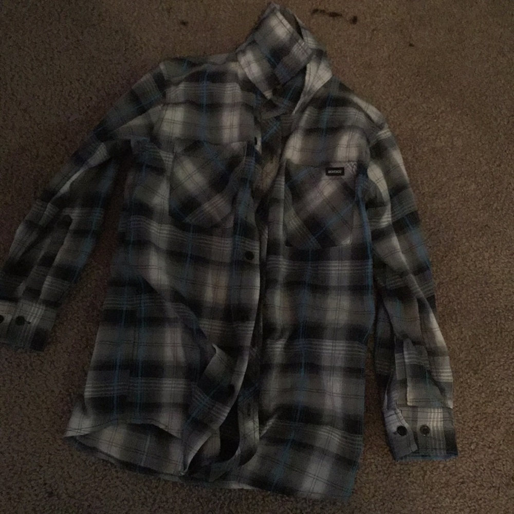 A black white grey and blue plaid shirt